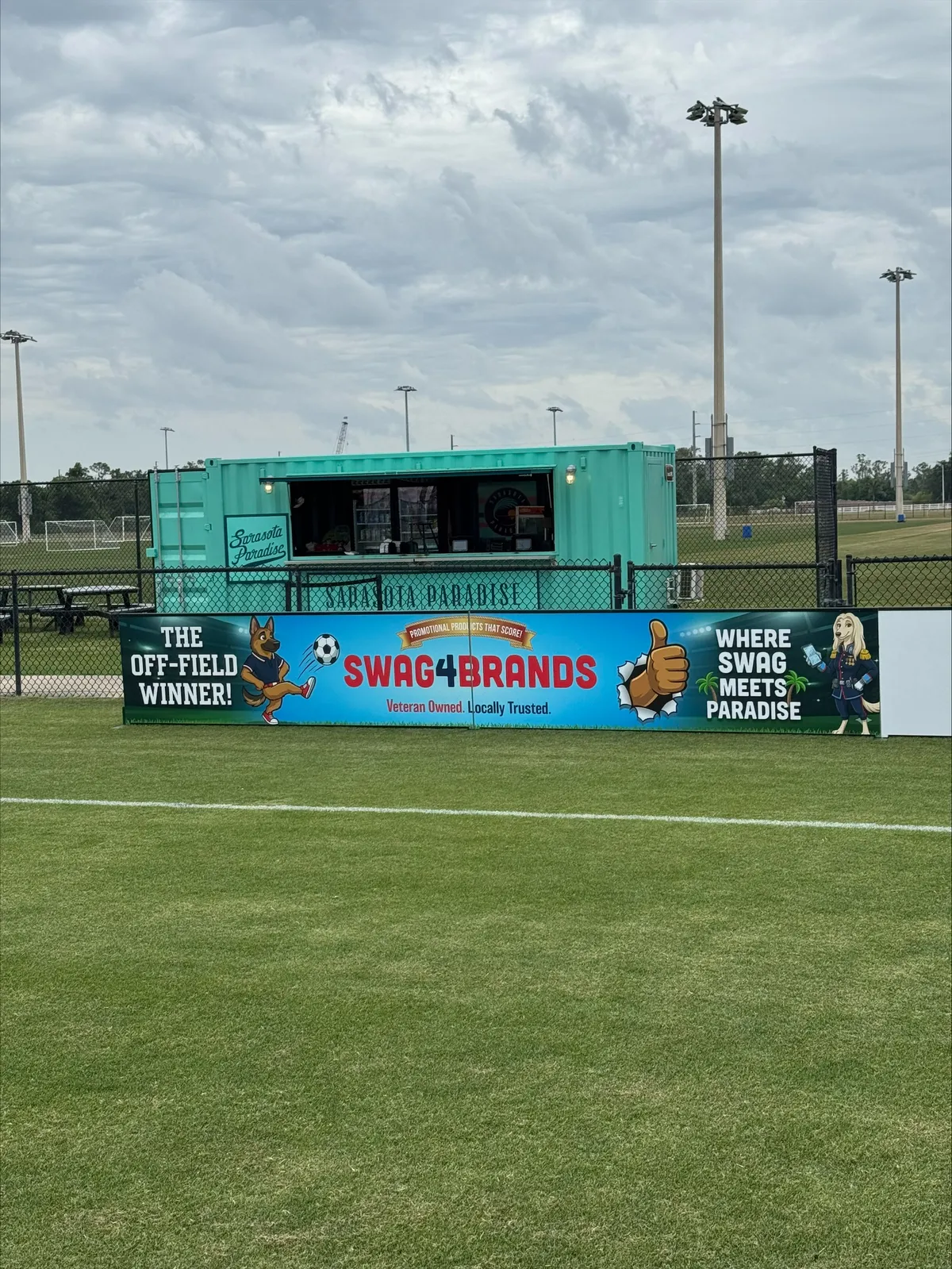 Swag4Brands billboard at Sarasota Paradise soccer field — The Off-Field Winner, Where Swag Meets Paradise